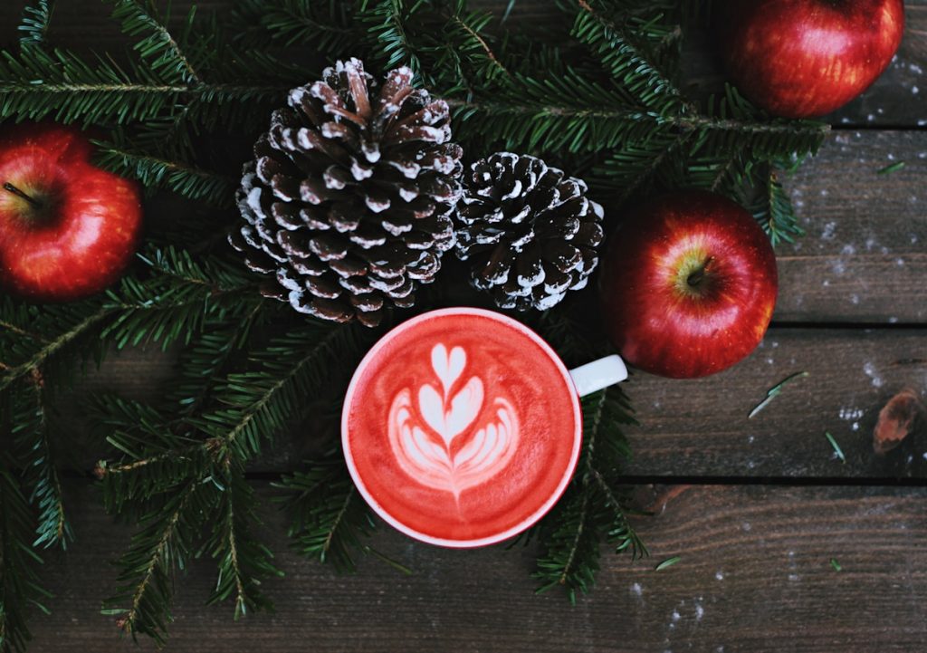 red coffee latte on white ceramic mug