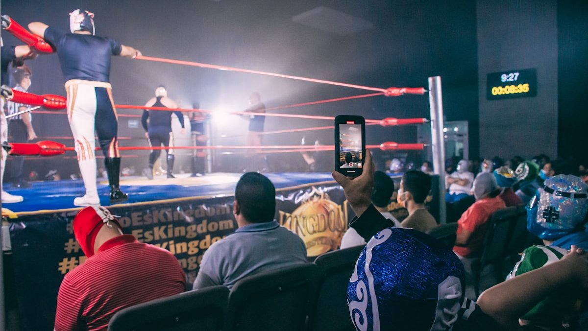 a group of people in a wrestling ring